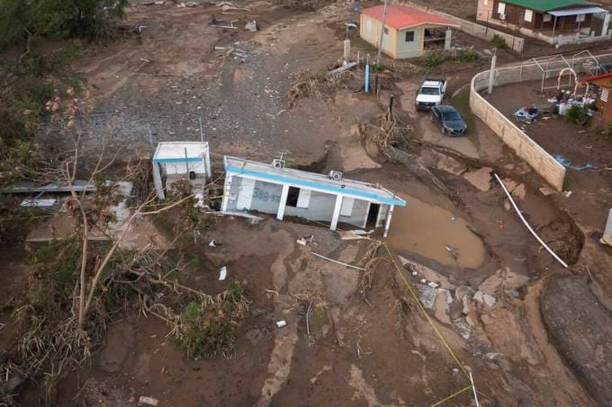 A house lies in the mud after it was washed away by Hurricane Fiona at Villa Esperanza in Salinas, Puerto Rico, Sept. 21. (Alejandro Granadillo/AP)