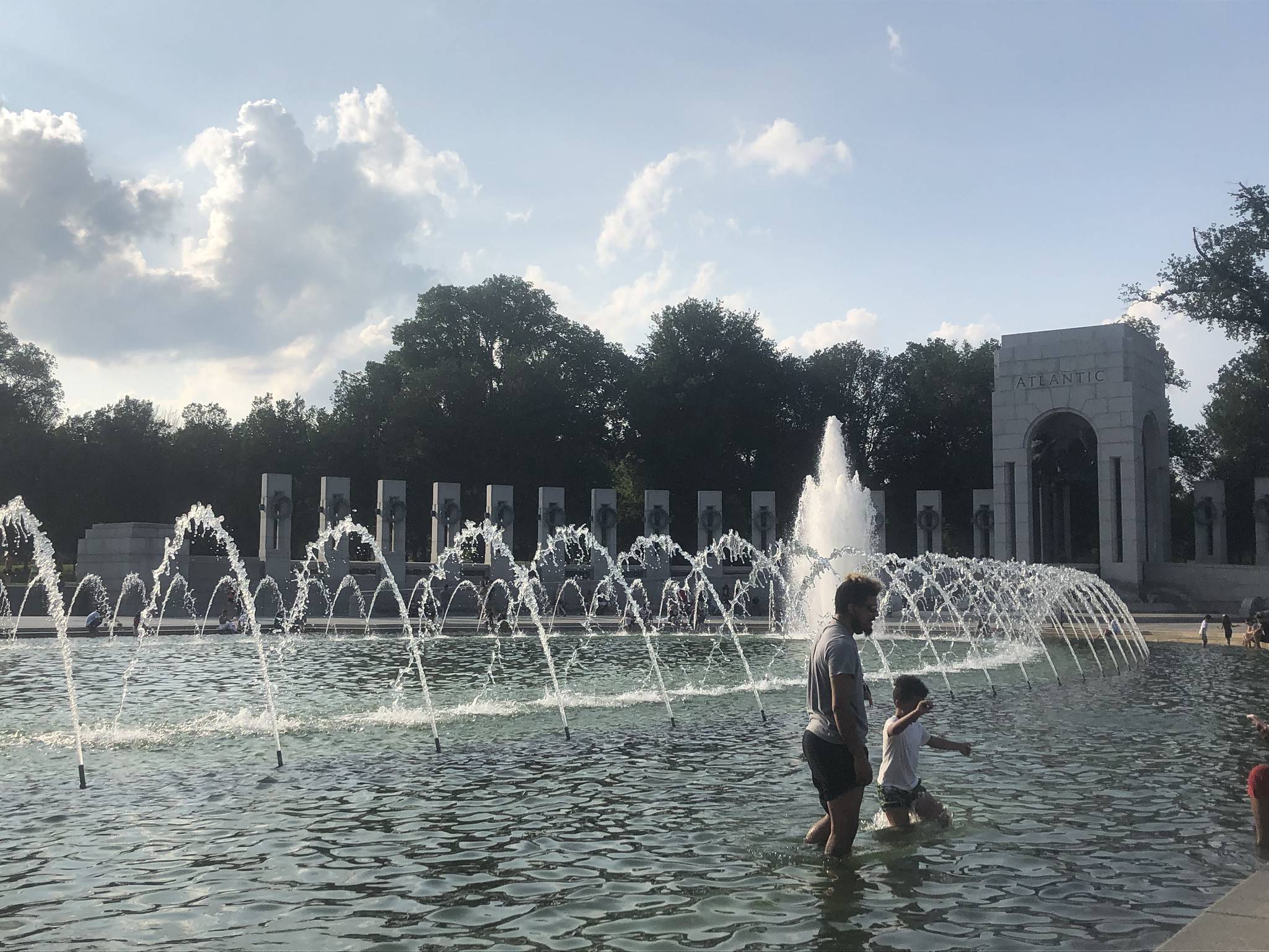 Cooling off at the World War II Memorial on Monday. (Jeannie in D.C./Flickr)