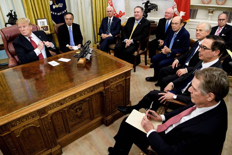 President Trump waits with his trade team for a meeting with Chinese Vice Premier Liu He in the Oval Office on Jan. 31. (Brendan Smialowski/AFP/Getty Images)  