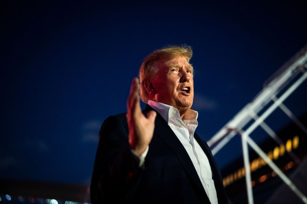 On Feb. 22, former president Donald Trump talks to reporters as he disembarks his airplane known as 