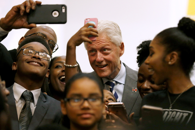 Bill Clinton visits Grace Emmanuel Baptist Church this past Sunday in Flint, Michigan. (Tegan Johnston/The Flint Journal-MLive.com via AP)</p>  