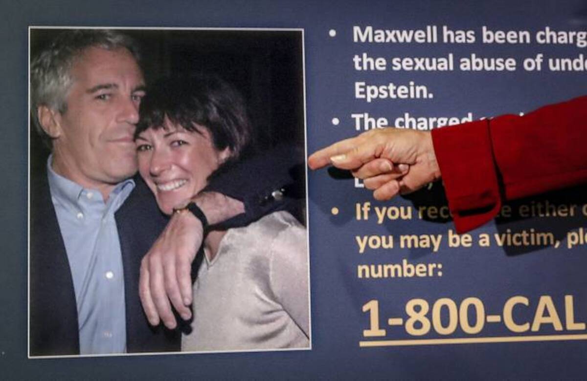 Audrey Strauss, acting U.S. attorney for the Southern District of New York, points to a photo of Jeffrey Epstein and Ghislaine Maxwell during a news conference in New York. (John Minchillo/AP file)