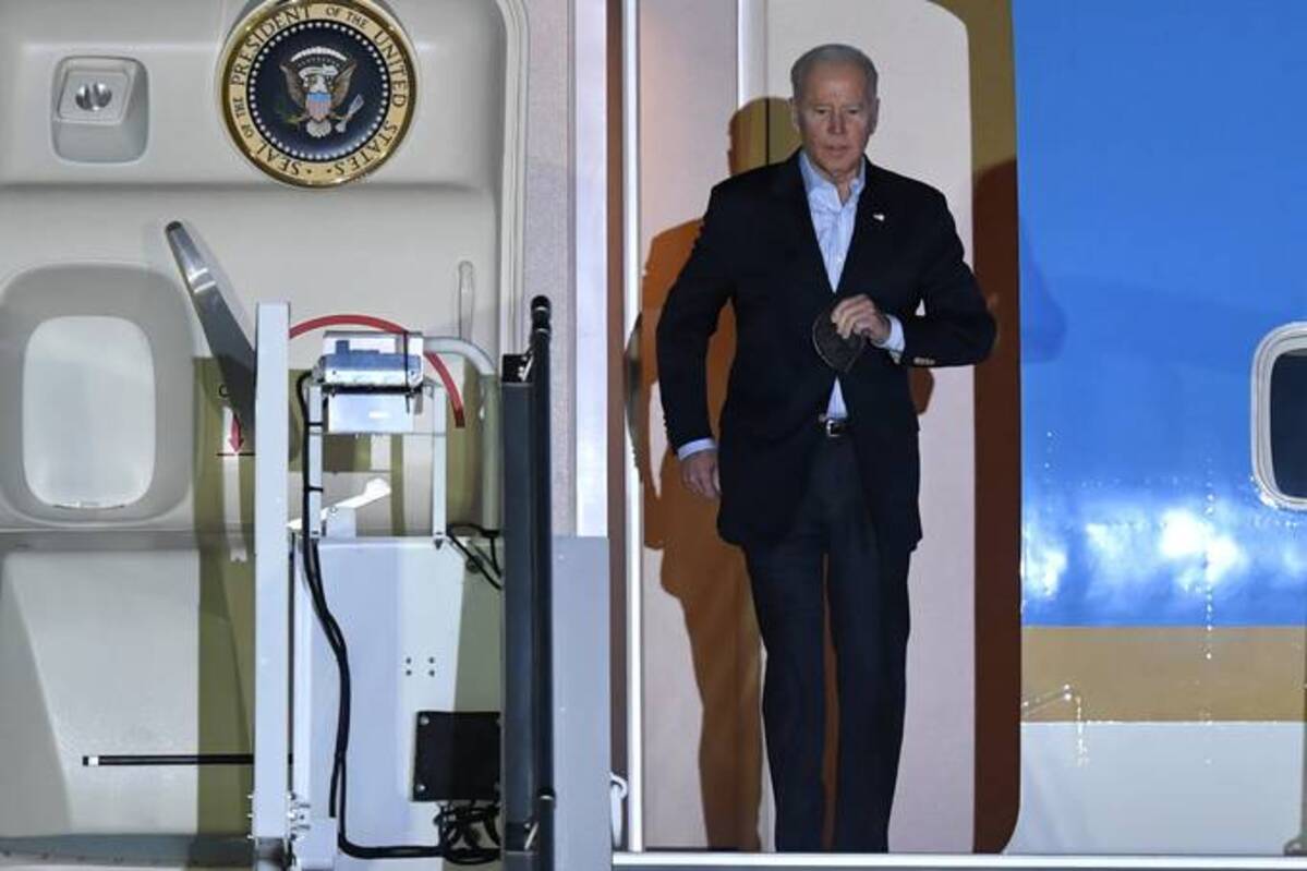 Biden disembarks the Air Force One as he arrives at Chopin Airport in Warsaw, Poland, on Friday. (Radek Pietruszka/EPA-EFE/REX/Shutterstock)