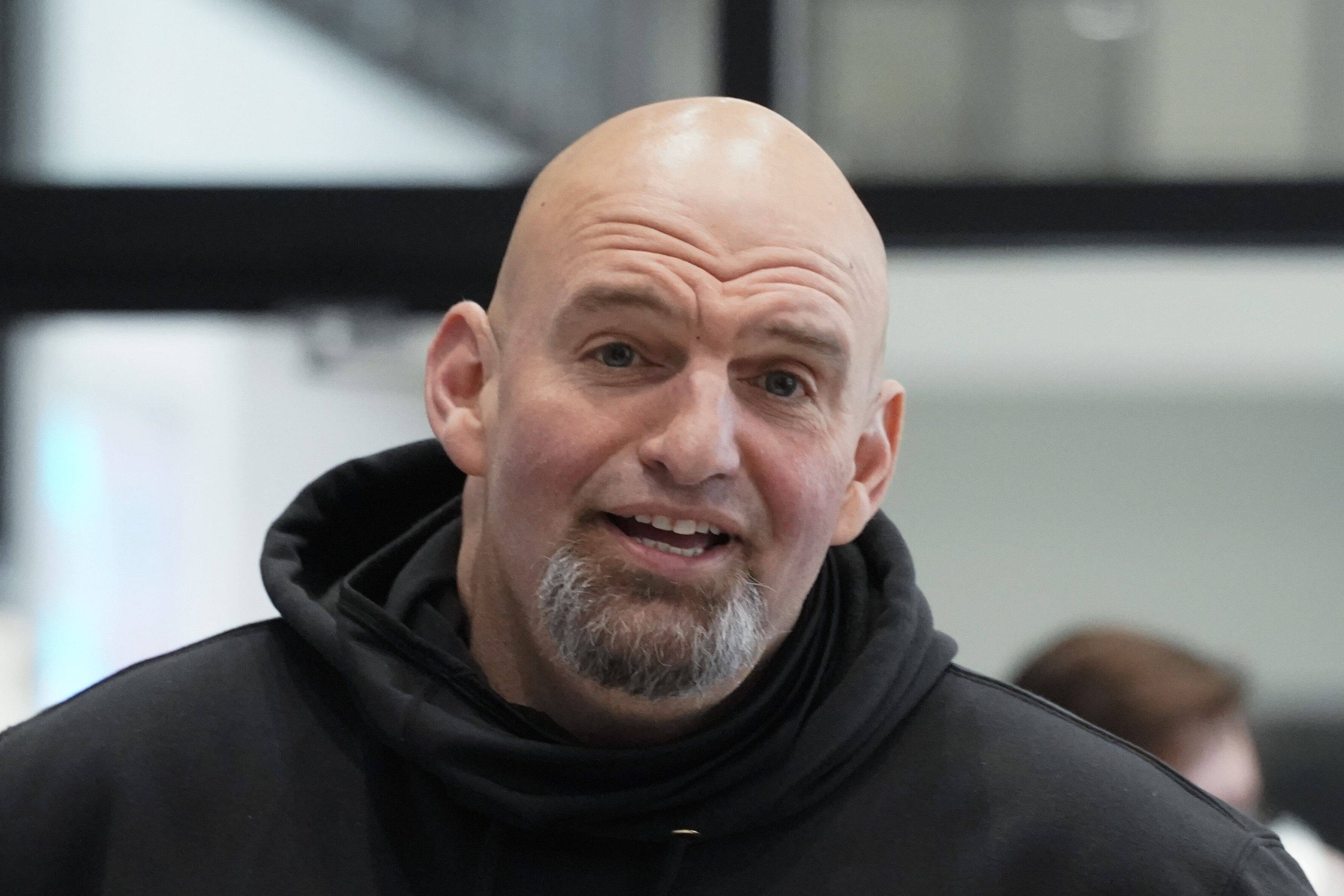 Pennsylvania Lt. Gov. John Fetterman visits with people attending a Democratic Party event at the Steamfitters Technology Center in Harmony, Pa., on March 4, 2022. (Keith Srakocic/AP)