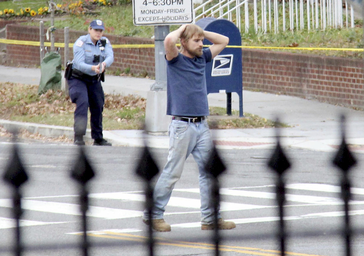Edgar Maddison Welch, 28 of Salisbury, N.C., surrenders to police last December. (Sathi Soma via AP, File)</p>  
