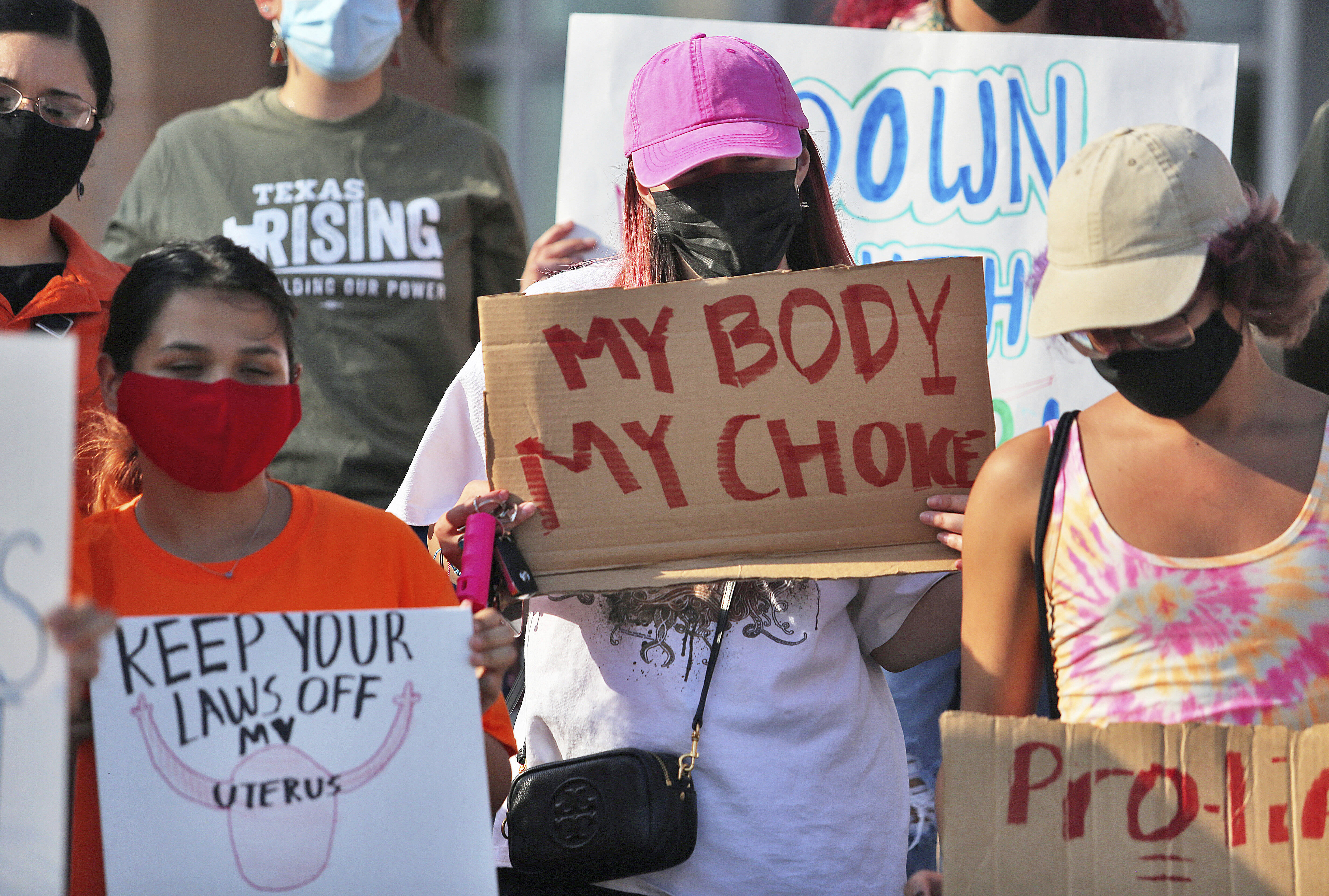 Abortion rights supporters protest the state's new law in Edinburg, Tex., on Wednesday. (Joel Martinez/The Monitor via AP)