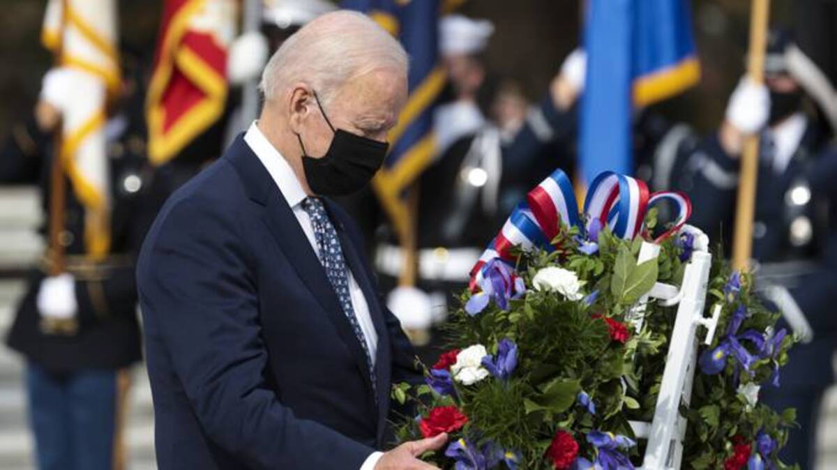 President Biden participates in a Presidential Armed Forces Full Honor Wreath-Laying Ceremony on the 100th anniversary of the Tomb of the Unknowns on Veterans Day at Arlington National Cemetery. (Oliver Contreras/Pool/EPA-EFE/Shutterstock)