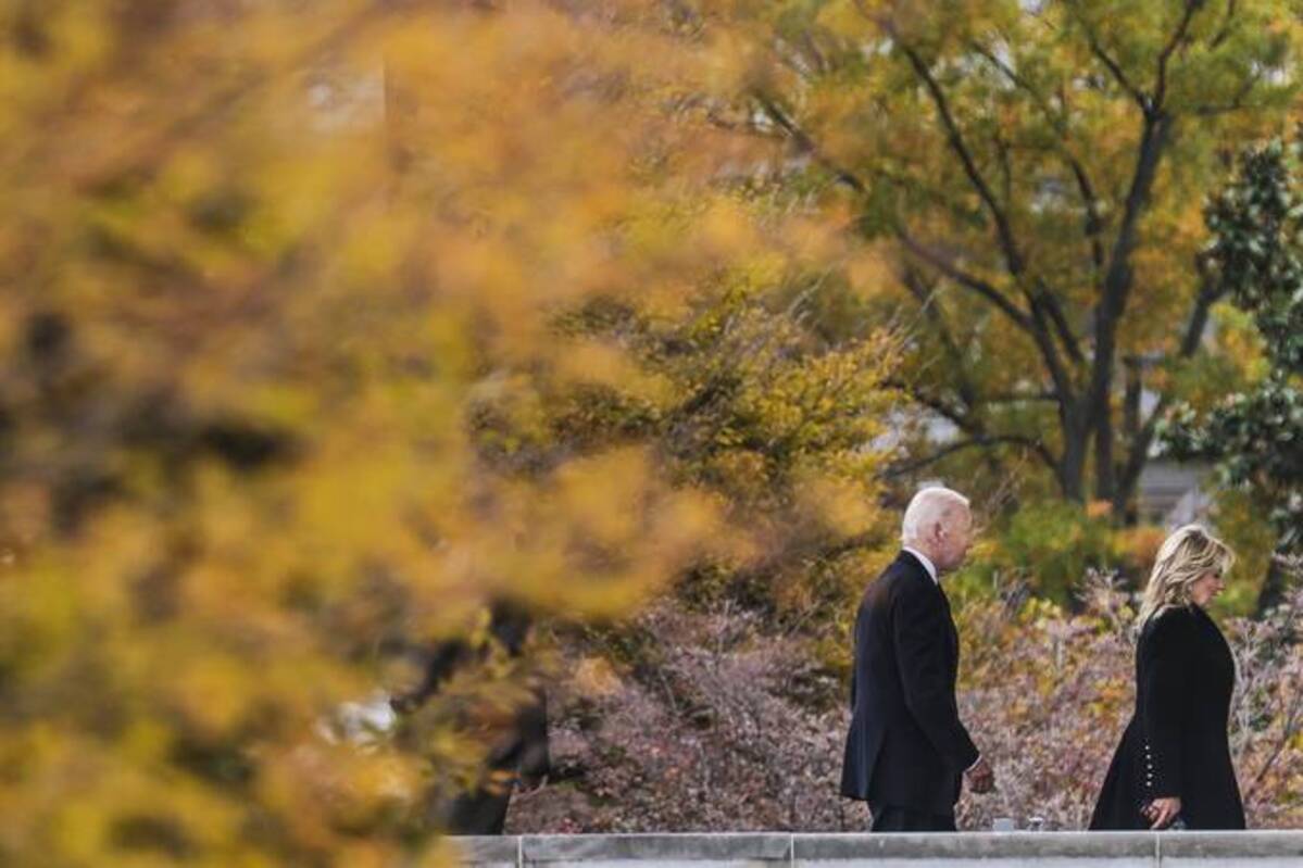 President Biden and first lady Jill Biden walk on the North Portico of the White House as they arrive from a trip to New York on Monday. (Oliver Contreras/The Washington Post)