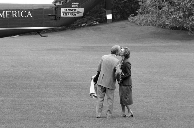 In this 1979 photo, President Jimmy Carter pauses to kiss first lady Rosalynn Carter as he boards a helicopter in Washington. (Barry Thumma/AP)