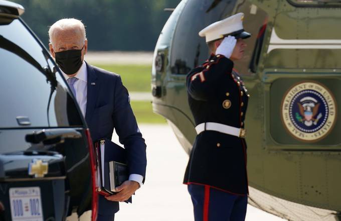 President Biden walks from Marine One to his limo in Wilmington, Del., on Aug. 12. (Kevin Lamarque/Reuters)