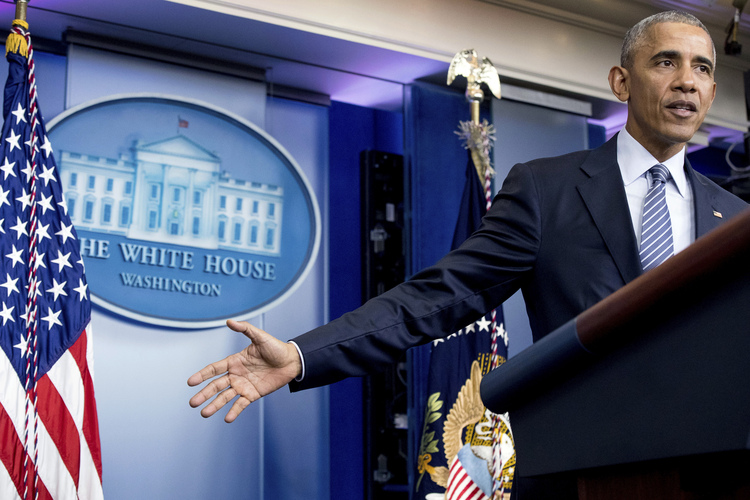 Obama speaks. (Andrew Harnik/AP)</p>  