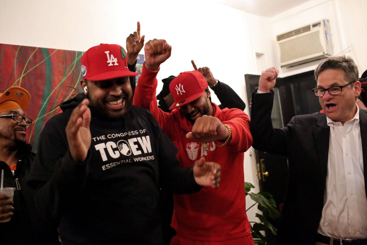 Co-founder of the Amazon Labor Union Gerald Bryson, organizer Jordan Flowers, founder and president Chris Smalls, and attorney Seth Goldstein celebrate their successful unionization vote on April 1 in Brooklyn. (Yana Paskova for The Washington Post)