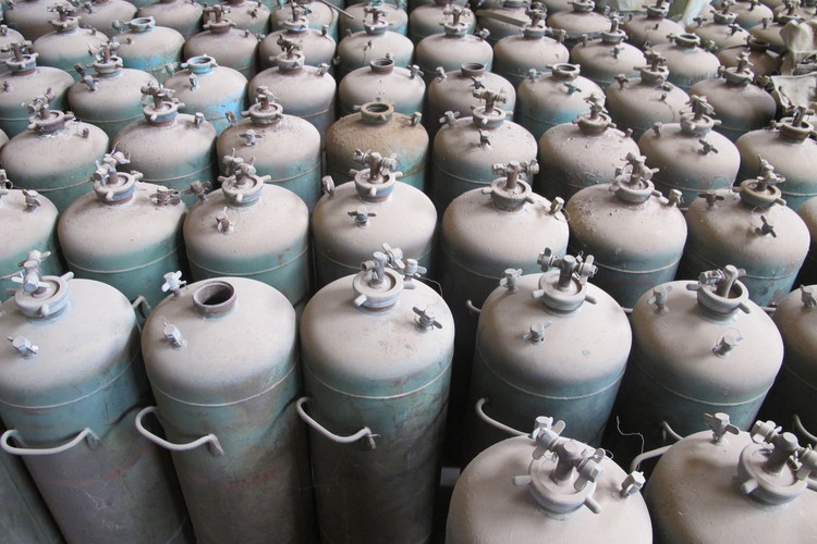 Gas tanks lie in several warehouses at a military camp abandoned by fleeing pro-Gaddafi troops. Documents at the site suggest chemical warfare protection suits and gas masks were sent to Gaddafi strongholds before the regime fell. (Photo by Simon Denyer/The Washington Post)</p>  