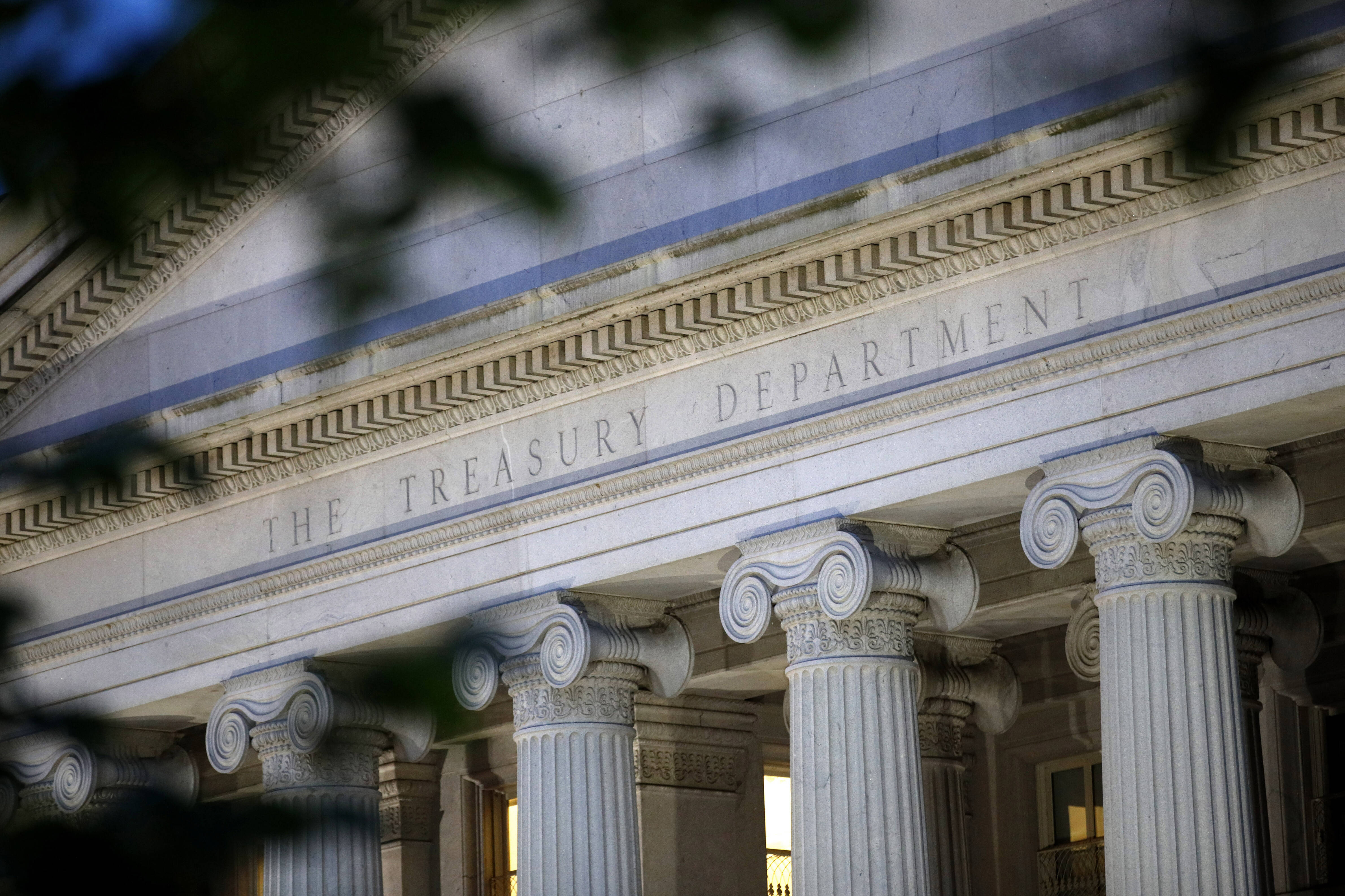 The U.S. Treasury Department building at dusk in 2019. (Patrick Semansky/AP)