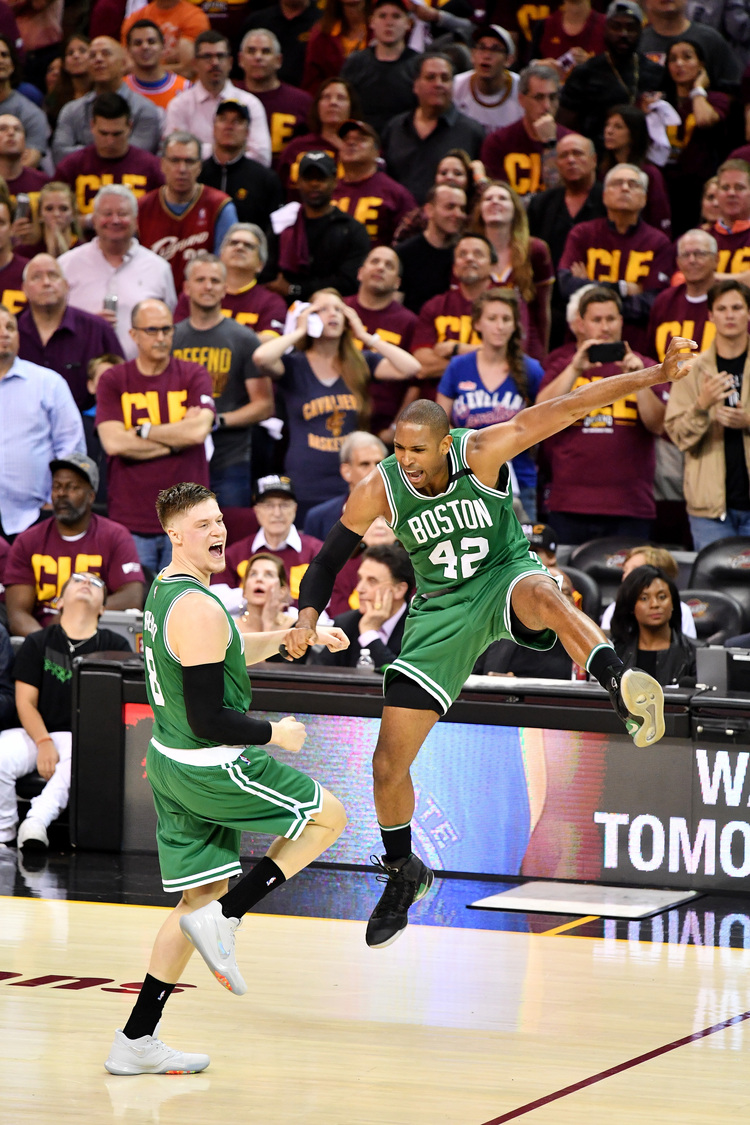 Al Horford celebrates with Jonas Jerebko after Boston's buzzer-beater at the Quicken Loans Arena. (Jamie Sabau/Getty Images)</p>