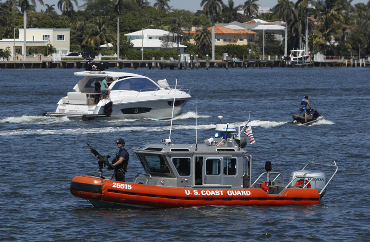 Coast Guard boats patrol the lagoon outside Mar-a-Lago in Palm Beach, Fla. (Manuel Balce Ceneta/AP)</p>