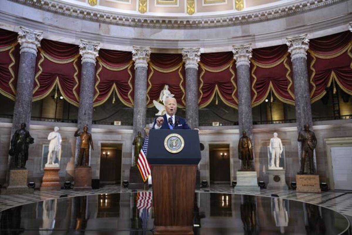 President Biden speaks from Statuary Hall at the U.S. Capitol to mark the one anniversary of the Jan. 6 riot at the U.S. Capitol by supporters loyal to then-President Donald Trump. (Drew Angerer/Pool via AP)