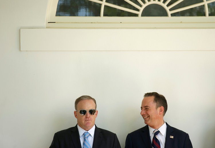 Sean Spicer and Reince Priebus watch Trump talk. (Joshua Roberts/Reuters)</p>