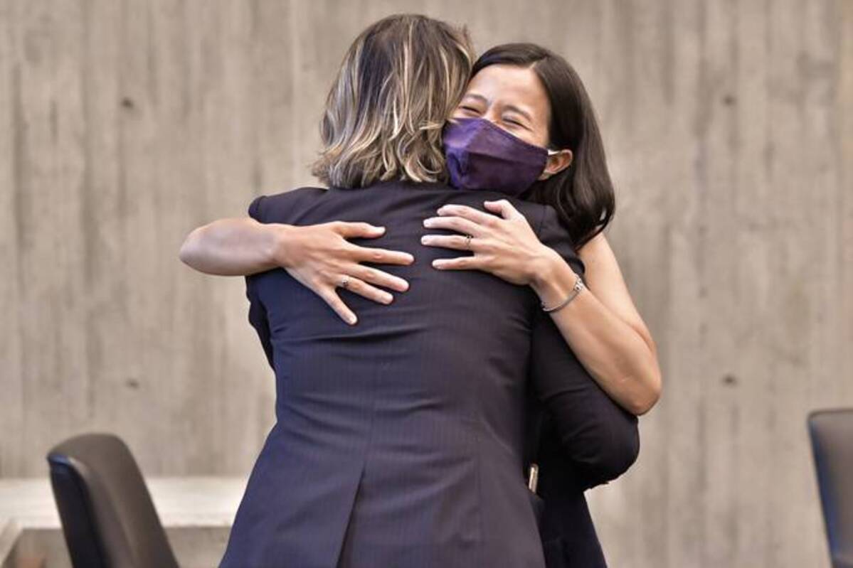 Boston mayoral candidates City Councilors, from left, Annissa Essaibi George, and Michelle Wu embrace during a city council meeting at City Hall in Boston. (Josh Reynolds/AP)