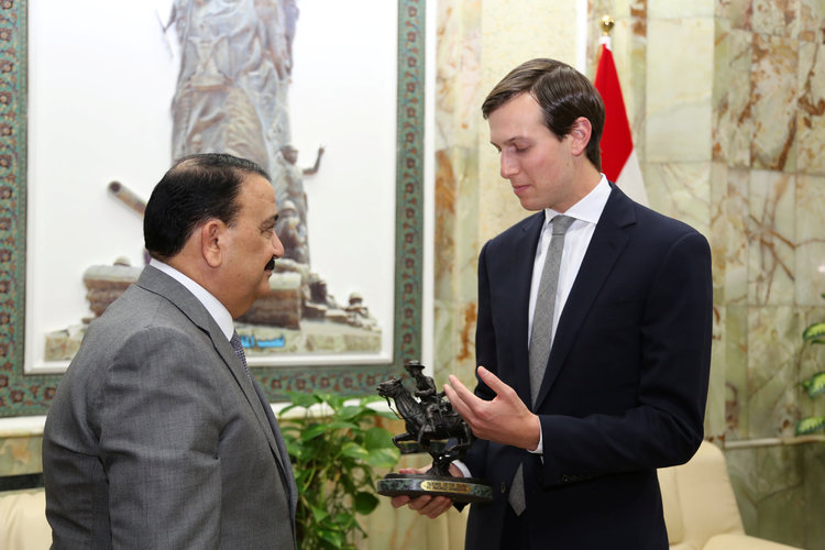 Iraq's Defence Minister Erfan al-Hiyalir welcomes Jared Kushner to Baghdad in April. (Stringer) </p>