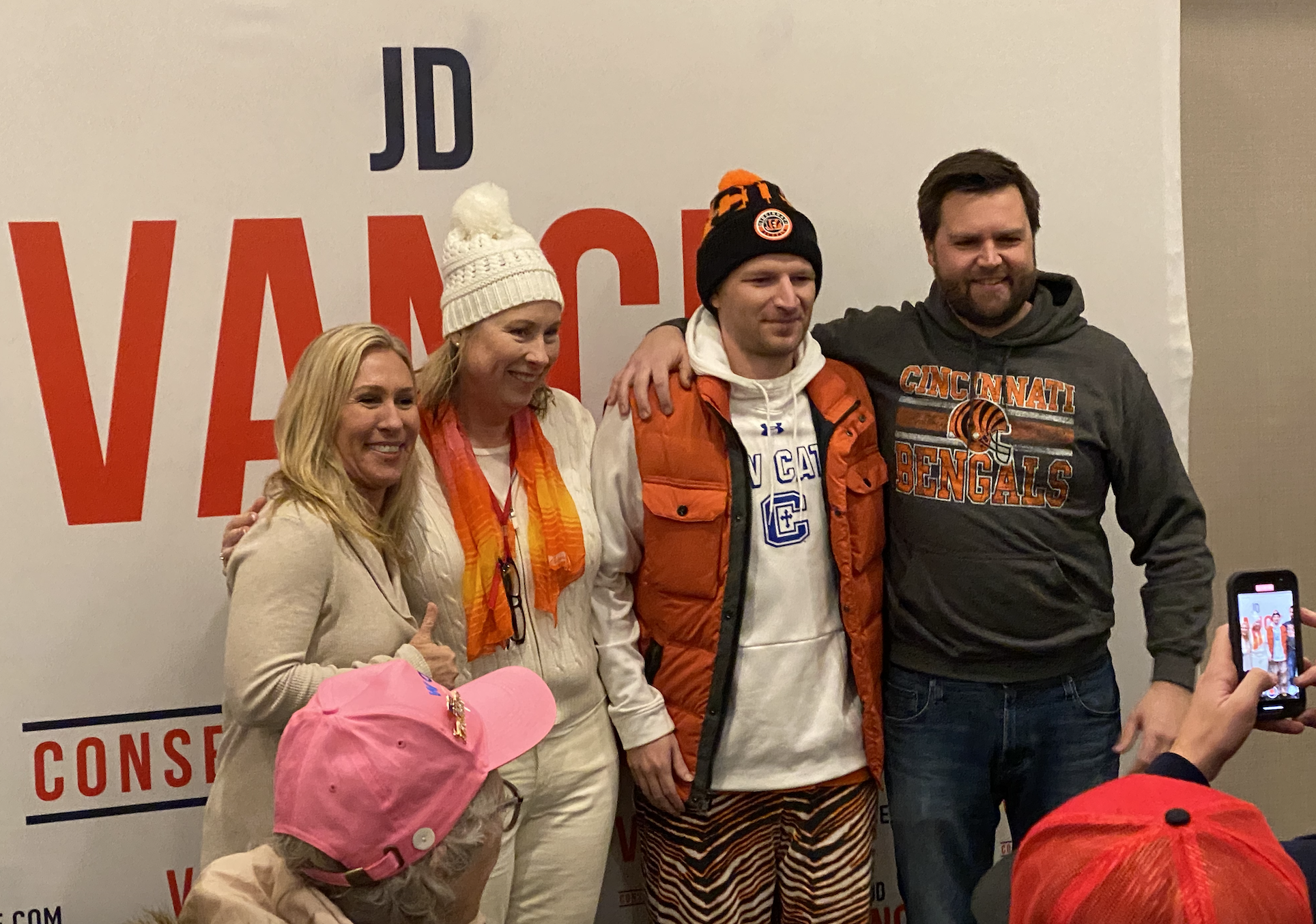 Ohio U.S. Senate candidate J.D. Vance and Rep. Marjorie Taylor Greene (R-Ga.) take photographs with voters Mason, Ohio, on Jan. 30. (David Weigel/The Washington Post)