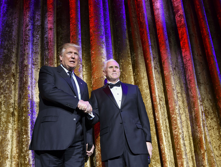 Donald Trump and Mike Pence attend a pre-inaugural dinner in Washington.&nbsp;(Ricky Carioti/The Washington Post)</p>  