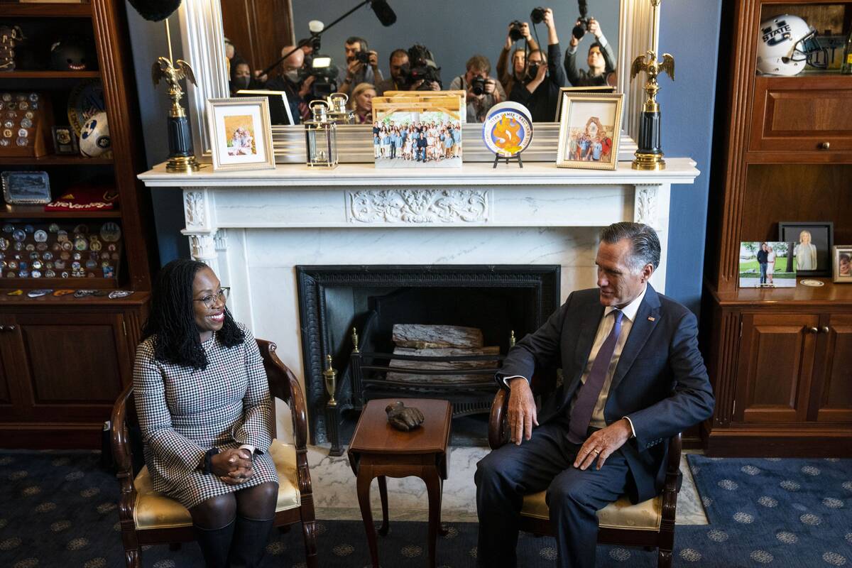 Ketanji Brown Jackson meets with Sen. Mitt Romney (R-Utah) on Tues., March 29. (Sarah Silbiger/Bloomberg)