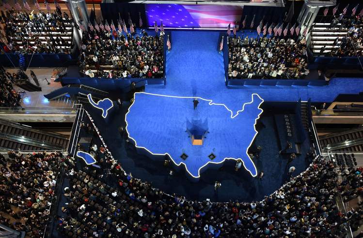 John Podesta leaves the stage after telling people at the Javits Convention Center to go home early this morning. (Jewel Samad/AFP/Getty Images)</p>  