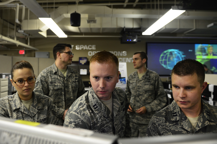Airmen working in the Joint Space Operations Center&nbsp;at Vandenberg Air Force Base in&nbsp;California.&nbsp;</p>  