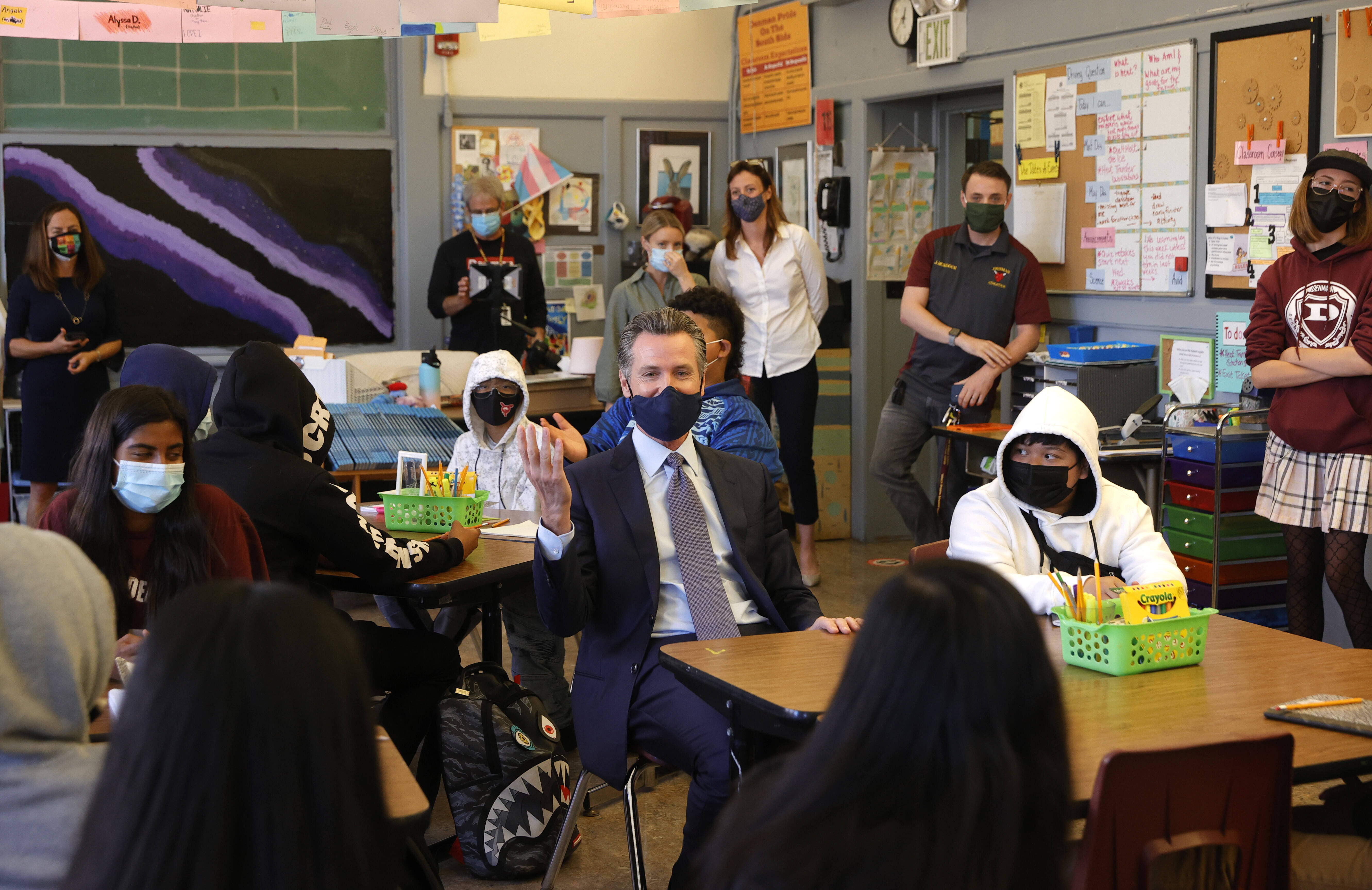 California Gov. Gavin Newsom (D) at a middle school in San Francisco on Friday, as he announced a vaccine mandate next year for students. (Justin Sullivan/Getty Images)