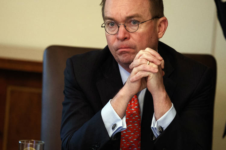 Acting White House chief of staff Mick Mulvaney listens as President Trump speaks during a Cabinet meeting at the White House. (Evan Vucci/AP)  