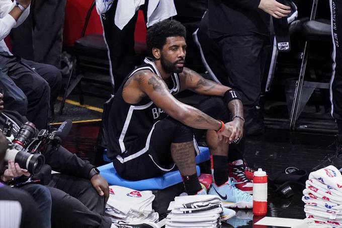 Kyrie Irving has a decision to make Wednesday when he can either opt in or decline his player option. (John Micnchillo/AP)