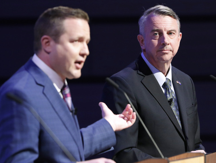 Virginia Republican gubernatorial candidate Ed Gillespie, right, listens as Corey Stewart, left, attacks him during a debate at Liberty University last night. (Steve Helber/AP)</p>  