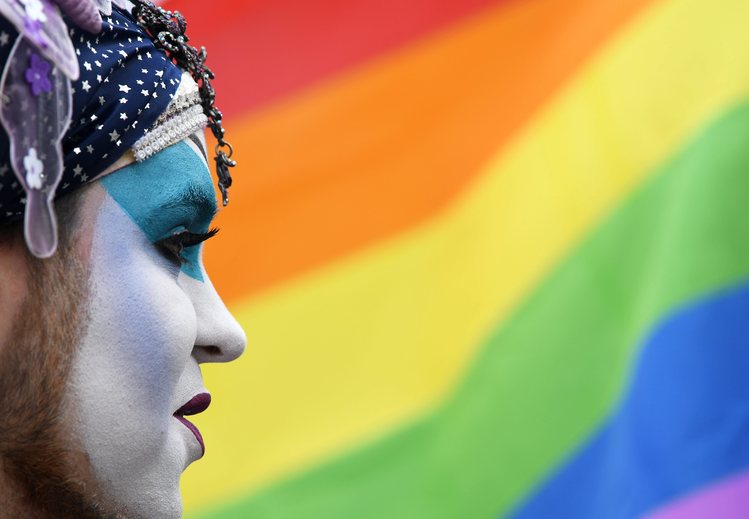 An activist of the lesbian, gay, bisexual and transgender&nbsp;(LGBT) movement named "Sister&nbsp;Dominique" stands&nbsp;in front of a rainbow flag in&nbsp;Potsdam yesterday. (EPA/Ralf&nbsp;Hirschberger)</p>  