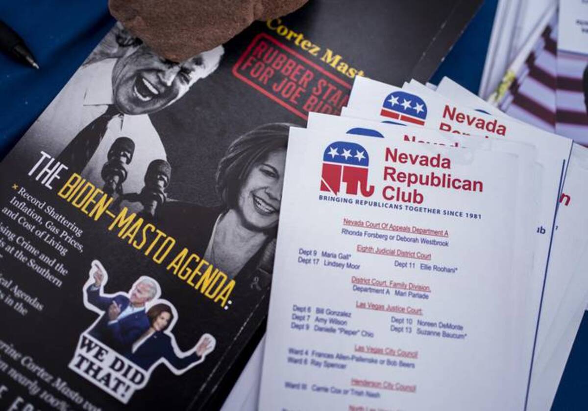 Republican political literature sits on a table while Nevada Republican Senate candidate Adam Laxalt speaks at a 