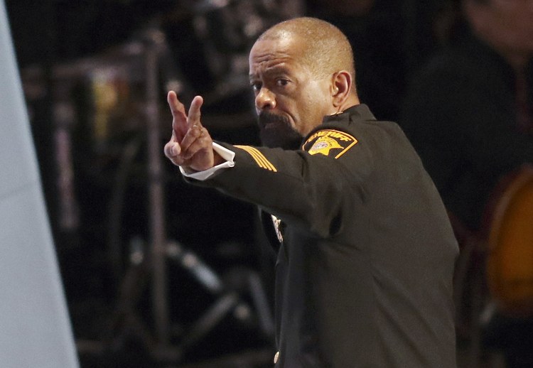 Milwaukee County Sheriff David Clarke gestures after speaking in Cleveland. (Reuters/Aaron Josefczyk)</p>  