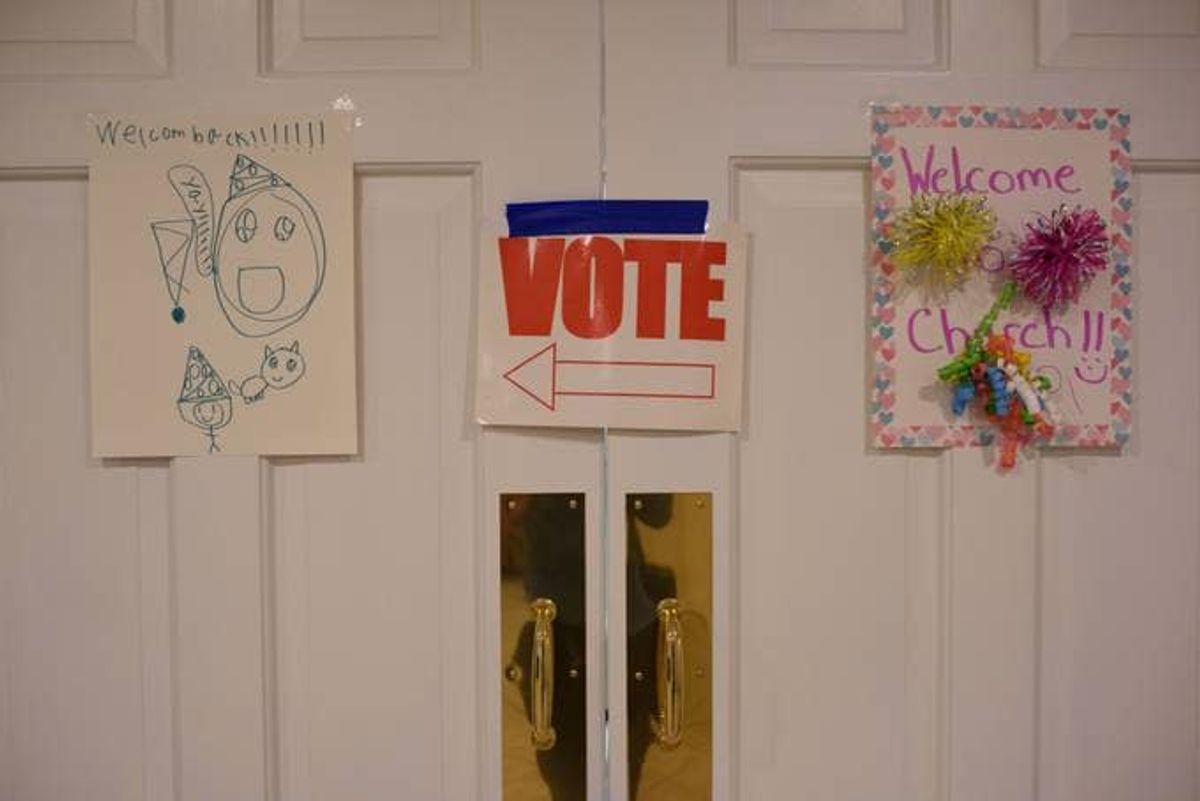 A sign inside a church turned polling site direct people where to vote on Tuesday in Fayetteville, N.C. (Melissa Sue Gerrits/The Washington Post)