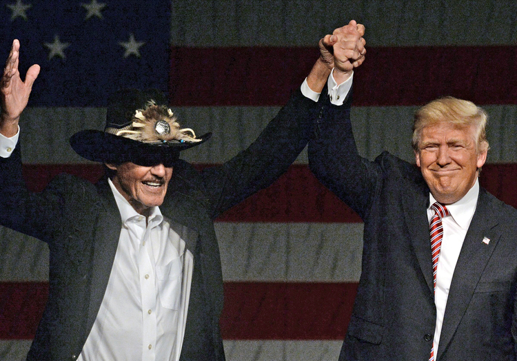 Trump introduces NASCAR great Richard Petty at his rally in the Greensboro Coliseum last night.&nbsp;(Chuck Liddy/The News &amp; Observer via AP)</p>  
