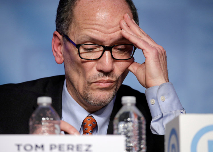 Former Secretary of Labor Tom Perez, a candidate for chairman of the Democratic National Committee, looks at his notes during a Saturday forum in Baltimore. (Joshua Roberts/Reuters)</p>  