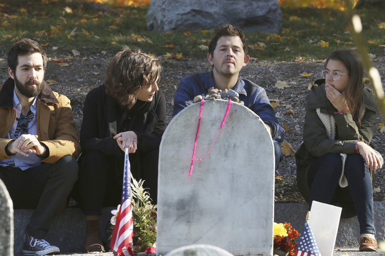 Four people visit Susan B. Anthony's grave at Mt. Hope Cemetery in Rochester, New York, yesterday. The cemetery will extend its hours on Election Day to give people more time to visit her grave. (Tina Macintyre-Yee/Democrat &amp; Chronicle via AP)</p>  