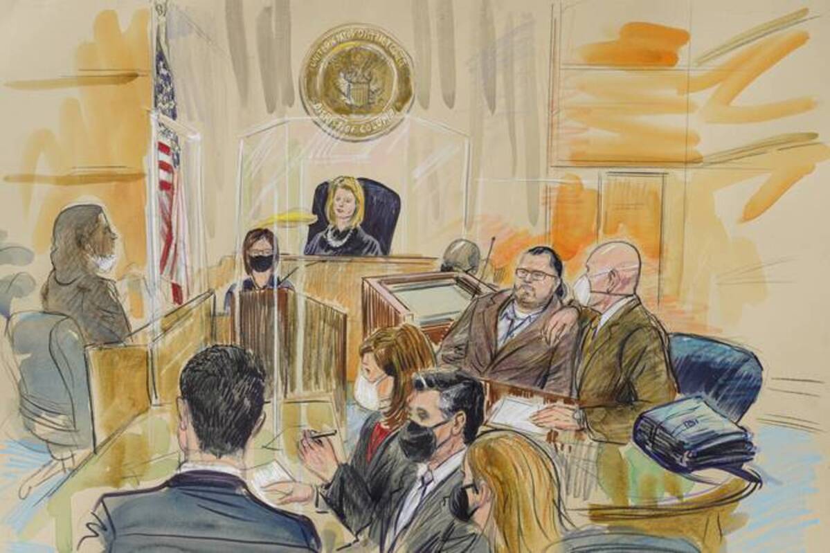 This artist sketch depicts Judge Dabney Friedrich looking out from the bench during jury selection for Guy Wesley Reffitt, joined by his lawyer William Welch, top right, in federal court, in Washington on Monday. (Dana Verkouteren via AP)