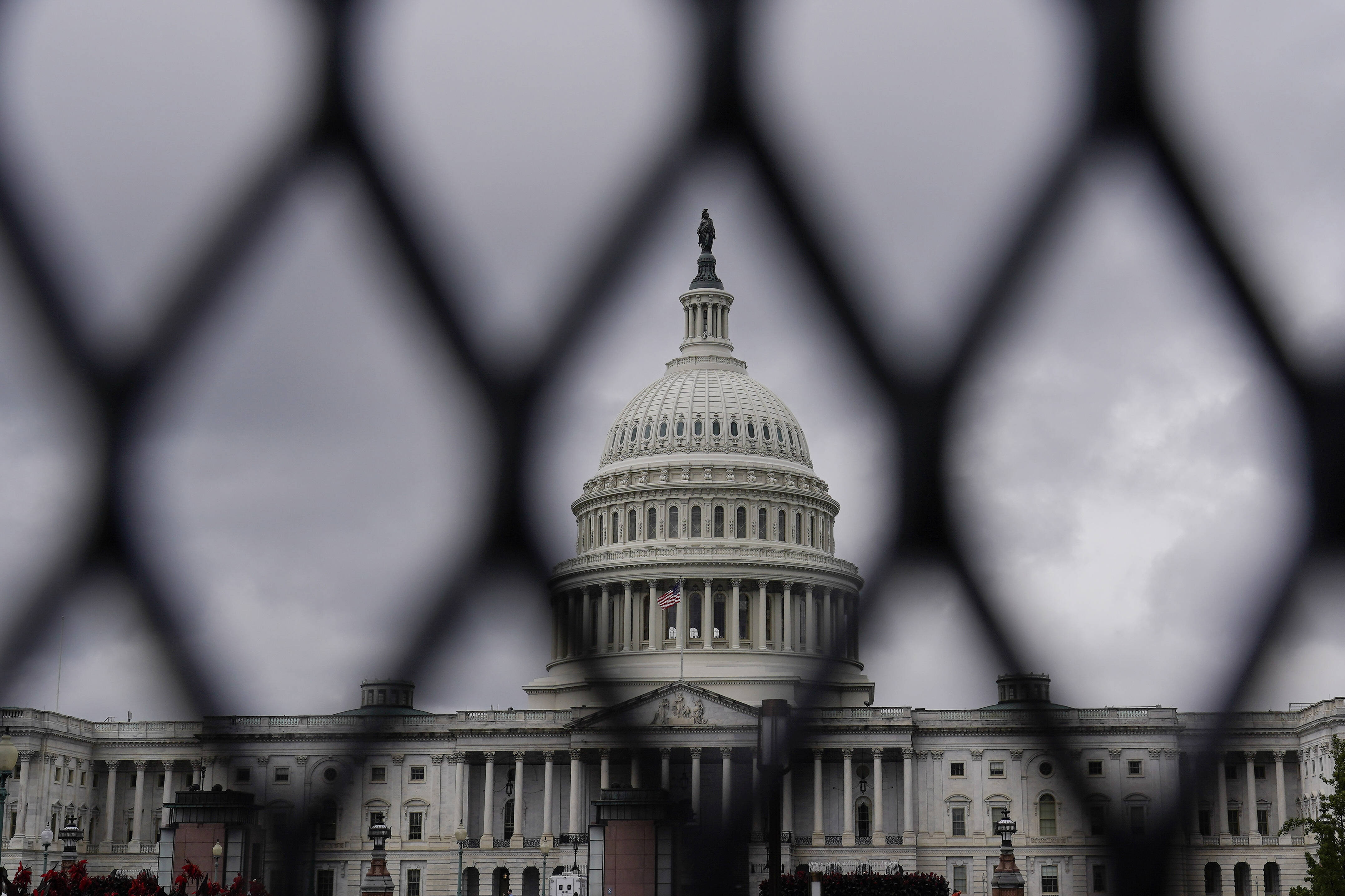 The U.S. Capitol is fenced off ahead of a rally Saturday in support of jailed Jan. 6 defendants. (Brynn Anderson/AP)