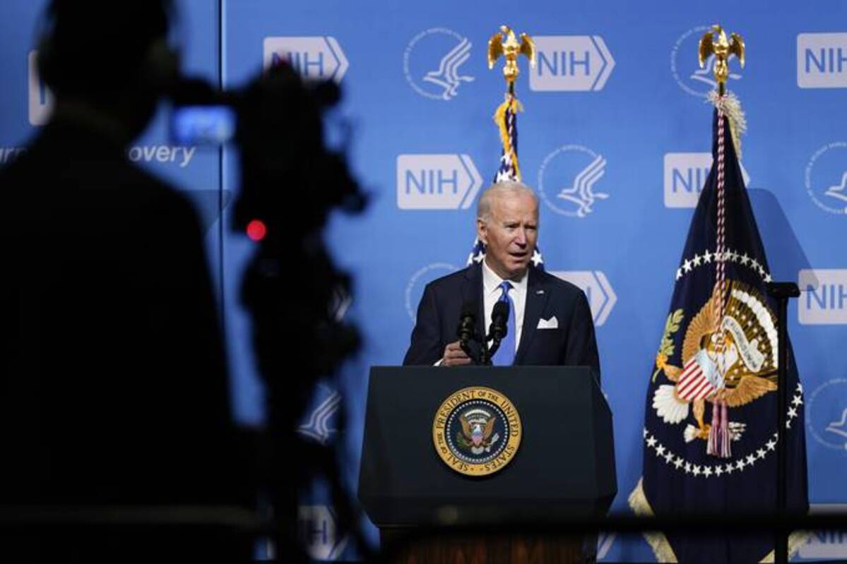 President Joe Biden speaks yesterday about the plan to battle Omicron at the National Institutes of Health. (AP Photo/Evan Vucci)