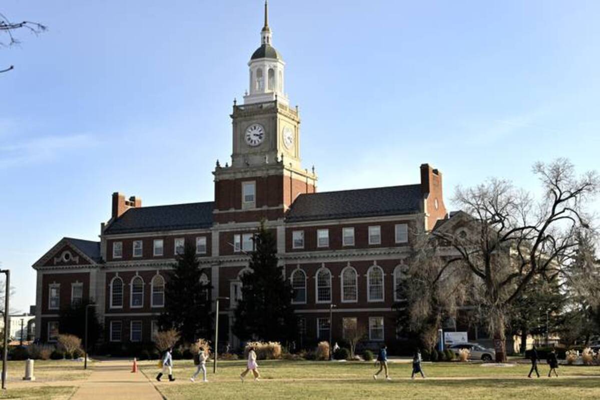People walk on the campus of Howard University in Washington on Tuesday, one of a series of historically Black colleges and universities to receive bomb threats in the past month. (Marvin Joseph/The Washington Post)