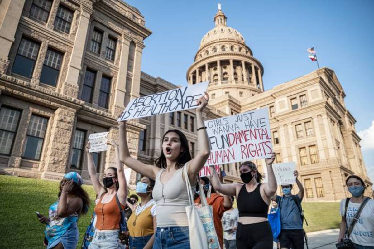Abortion rights supporters march outside the Texas Capitol. (Sergio Flores/The Washington Post)
