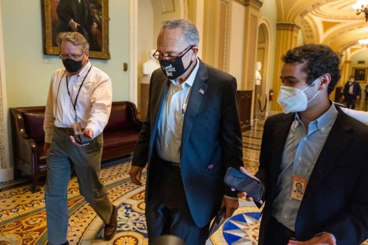 Senate Majority Leader Chuck Schumer walks to his office on Wednesday. Mandatory Credit: Photo by JIM LO SCALZO/EPA-EFE/Shutterstock