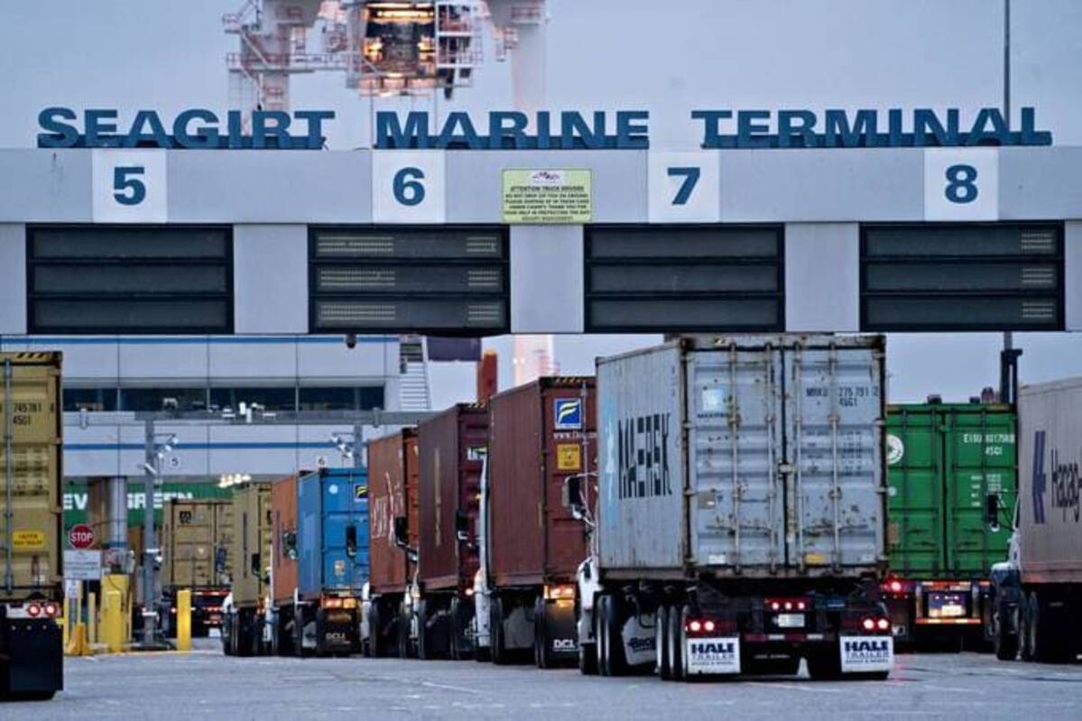 Tractor-trailer trucks wait to enter the Seagirt Marine Terminal at the Port of Baltimore in Baltimore. (Andrew Harrer/Bloomberg News)