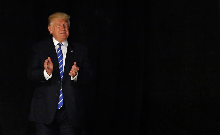 Donald Trump takes the stage at Gilley's in Dallas yesterday.&nbsp;(Photo by Ron Jenkins/Getty Images)</p>  