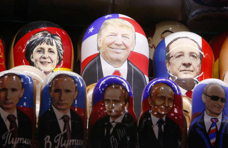 Painted Matryoshka dolls, or Russian nesting dolls, bearing the likeness of Donald Trump and Vladimir Putin are for sale at a souvenir shop in Moscow. (Sergei Karpukhin/Reuters)</p>  