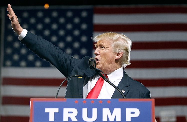 Donald Trump waves to supporters&nbsp;in Phoenix on Saturday. (Ralph Freso/Getty Images)&nbsp;</p>  